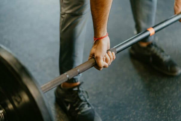 lifting a barbell while doing personal training in Heidelberg